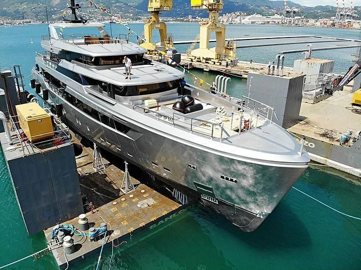 a large ship docked at a port aboard PAIZA ONE Yacht for Sale