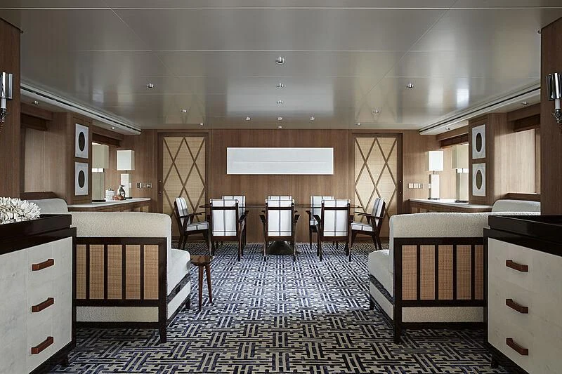 a large room with wooden cabinets aboard PAIZA ONE Yacht for Sale