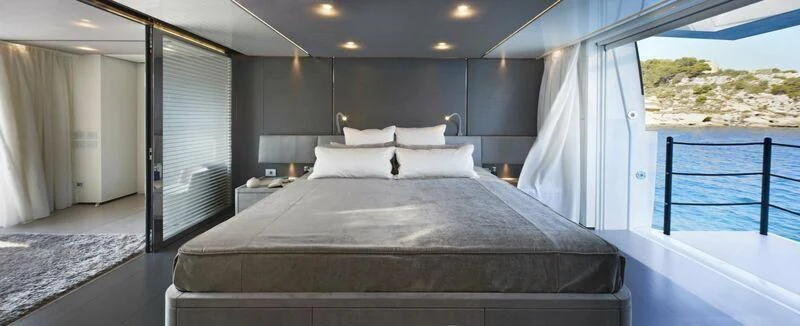 a bed in a room aboard PAIZA ONE Yacht for Sale