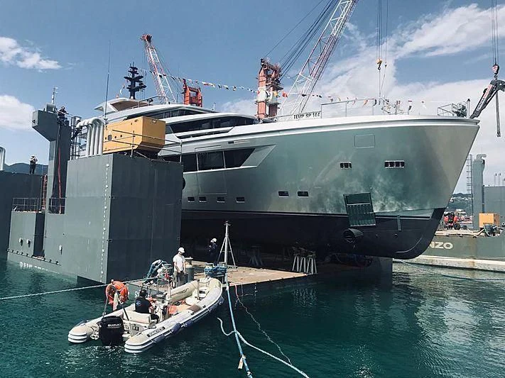 a large ship docked at a port aboard PAIZA ONE Yacht for Sale