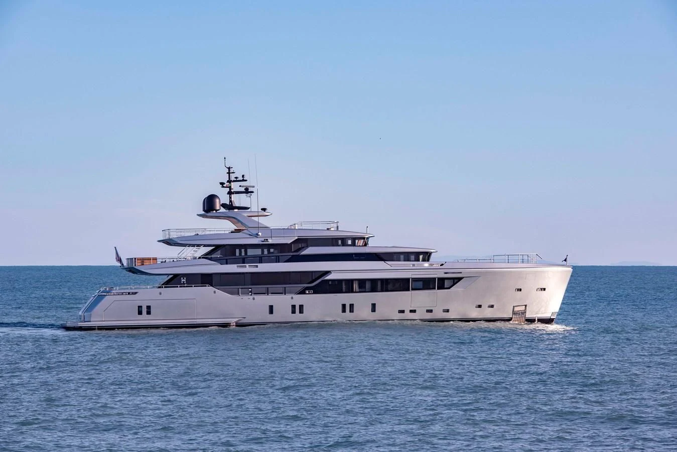 a large white ship in the water aboard PAIZA ONE Yacht for Sale