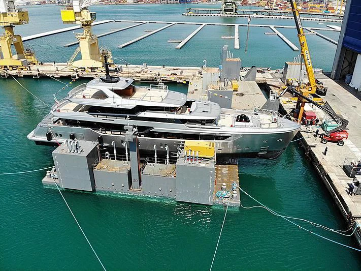 a large ship in a harbor aboard PAIZA ONE Yacht for Sale