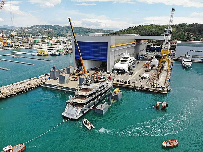a large ship docked at a port aboard PAIZA ONE Yacht for Sale