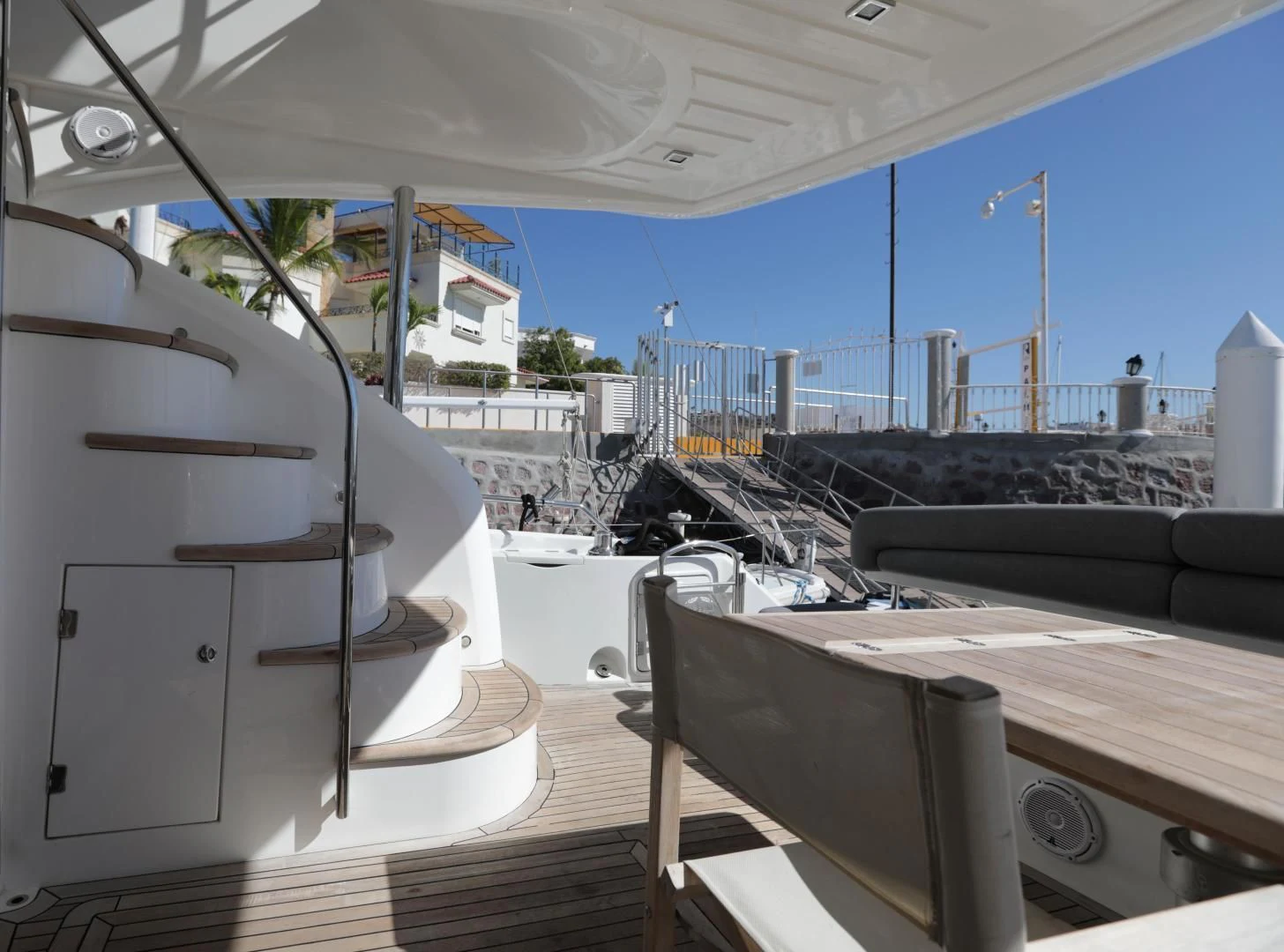 a room with a view of the ocean and the deck aboard CAPRICHO II Yacht for Sale