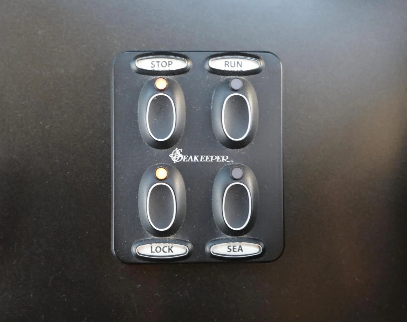 a black video game controller aboard CAPRICHO II Yacht for Sale
