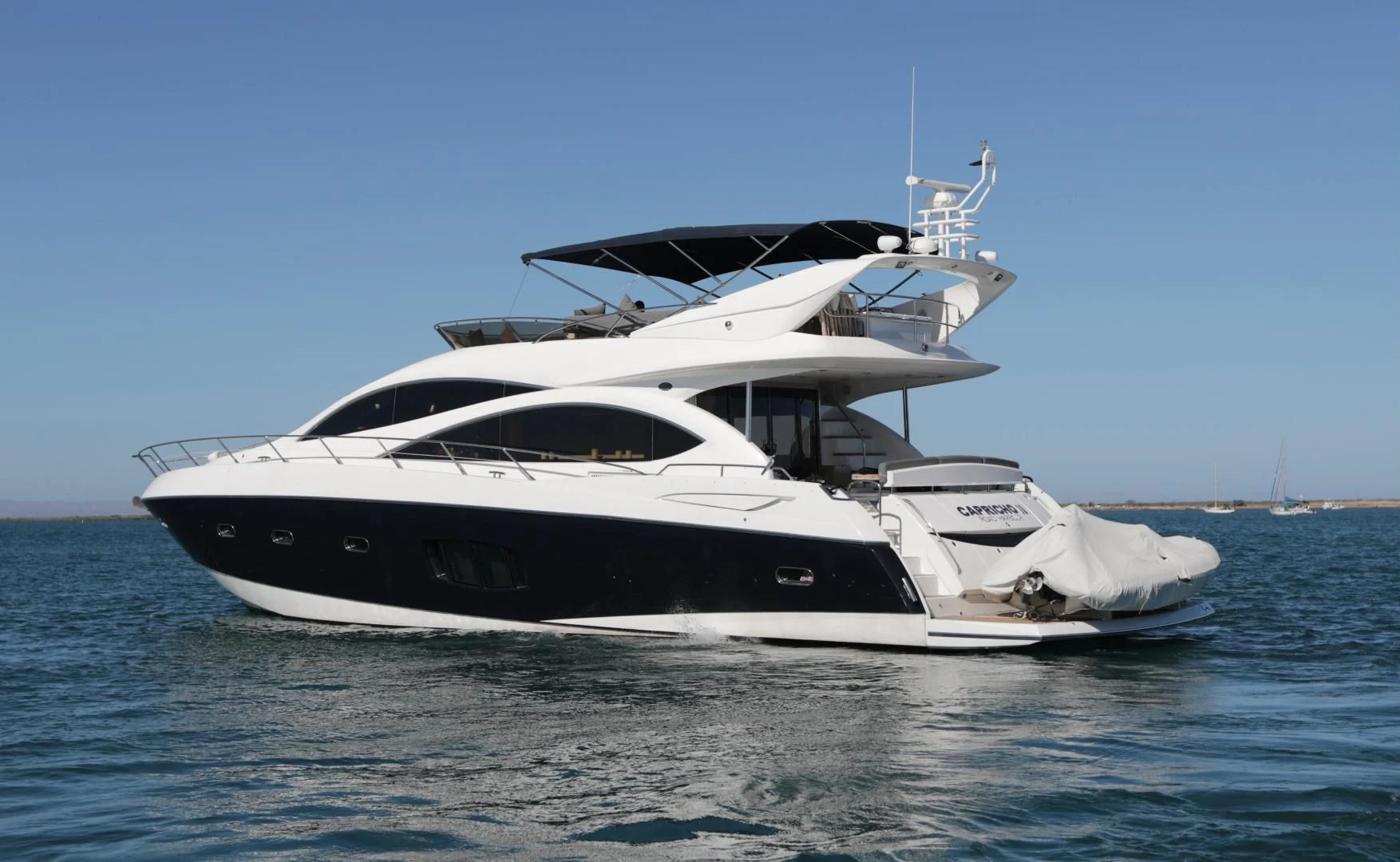a white yacht on the water aboard CAPRICHO II Yacht for Sale