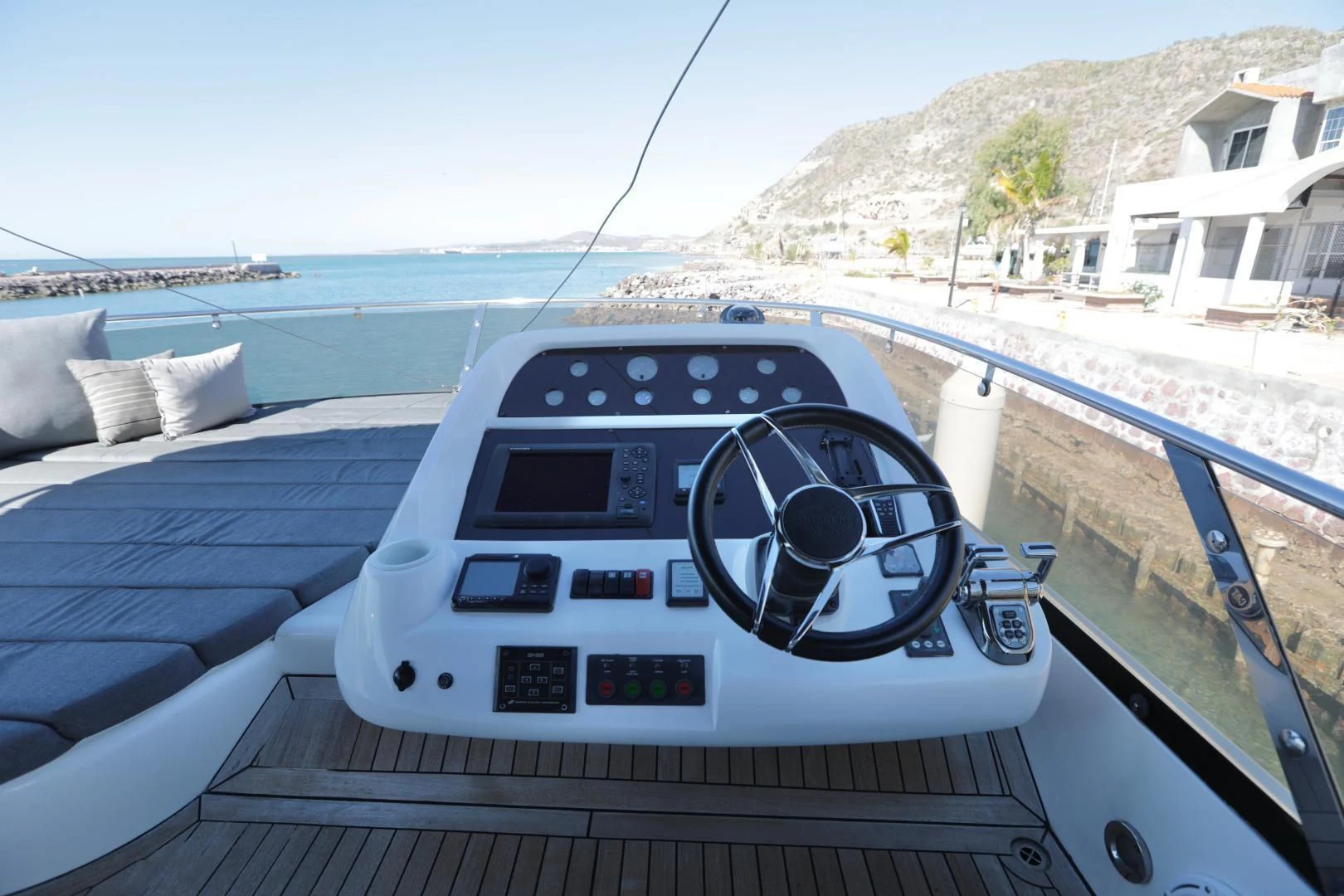 a car on a deck aboard CAPRICHO II Yacht for Sale