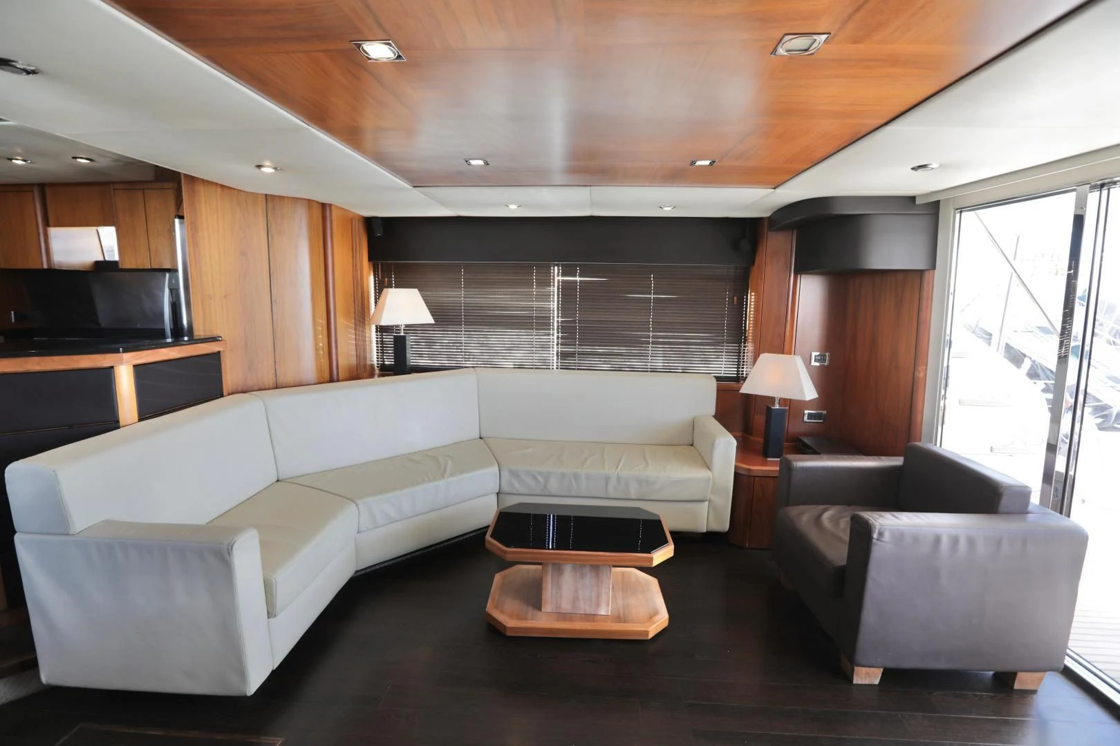 a living room with a couch and a table aboard CAPRICHO II Yacht for Sale