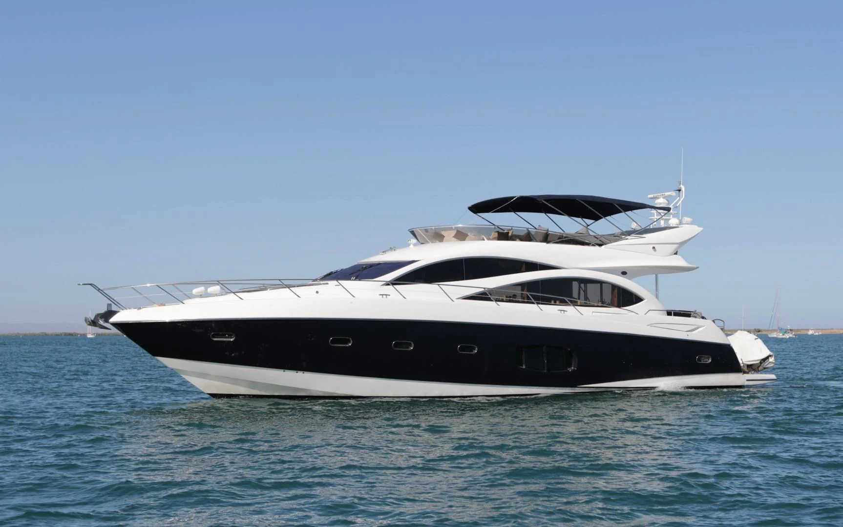 a white yacht on the water aboard CAPRICHO II Yacht for Sale