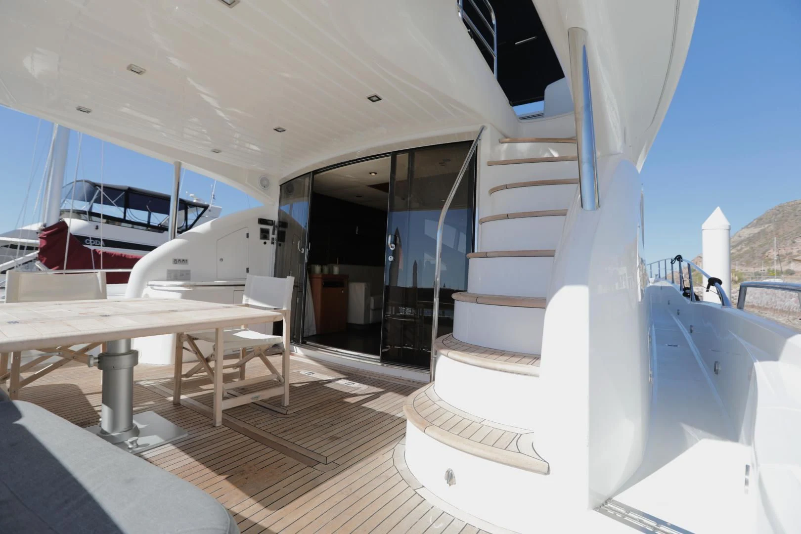 a white staircase in a building aboard CAPRICHO II Yacht for Sale