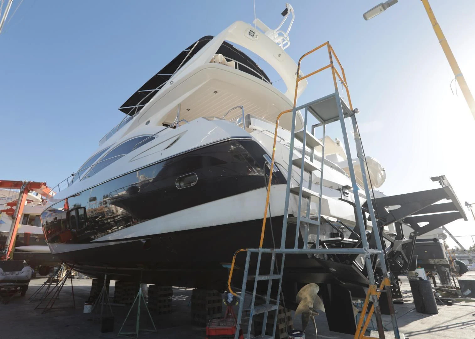 a large boat on a dock aboard CAPRICHO II Yacht for Sale