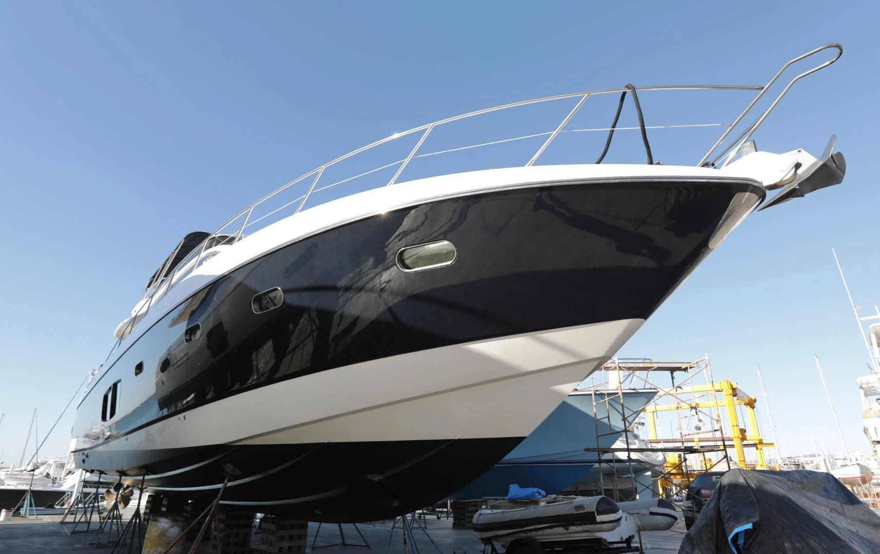 a large white yacht docked aboard CAPRICHO II Yacht for Sale