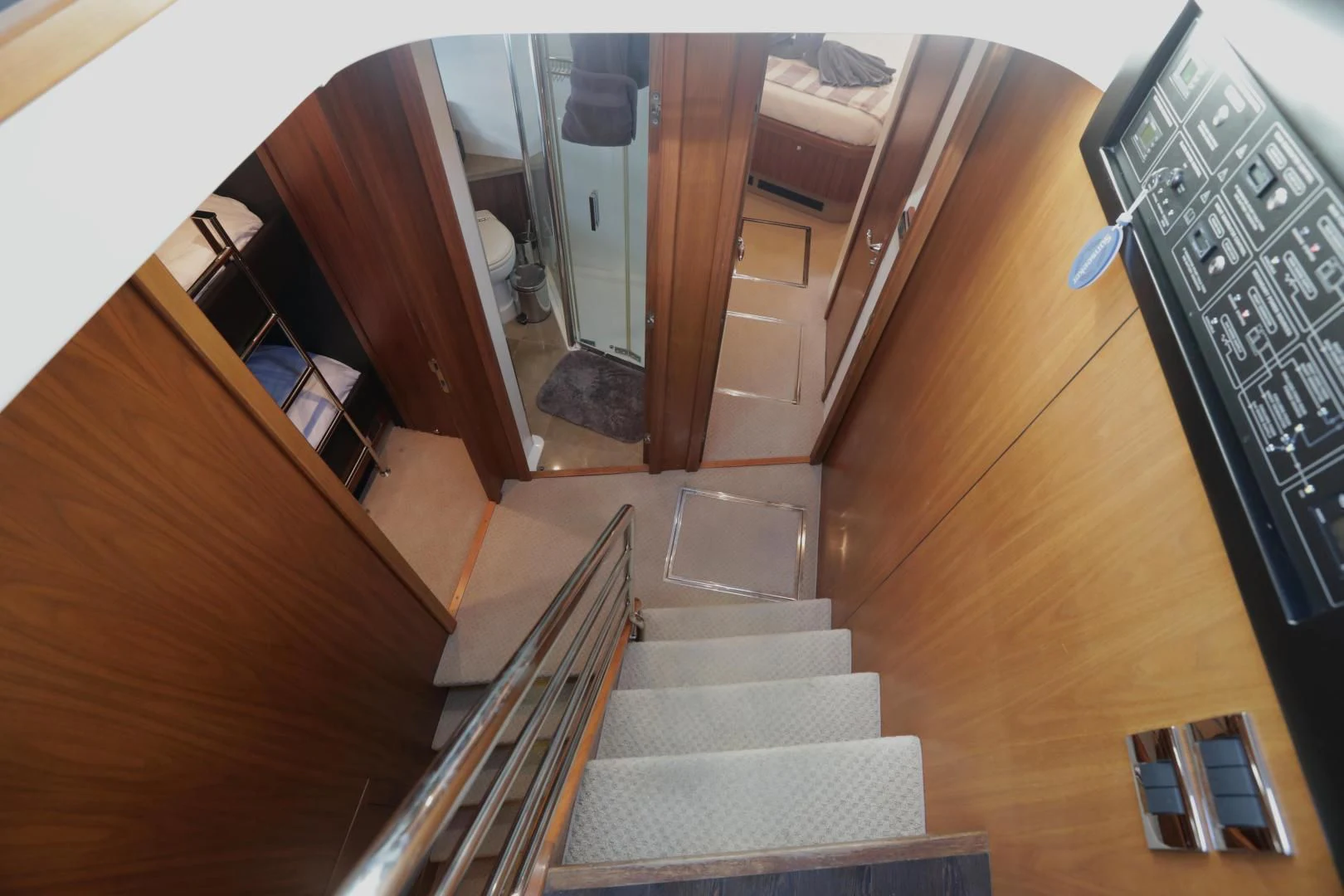 a hallway with a set of stairs aboard CAPRICHO II Yacht for Sale