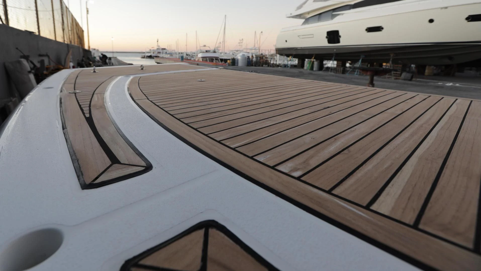 a deck with a wood deck aboard CAPRICHO II Yacht for Sale