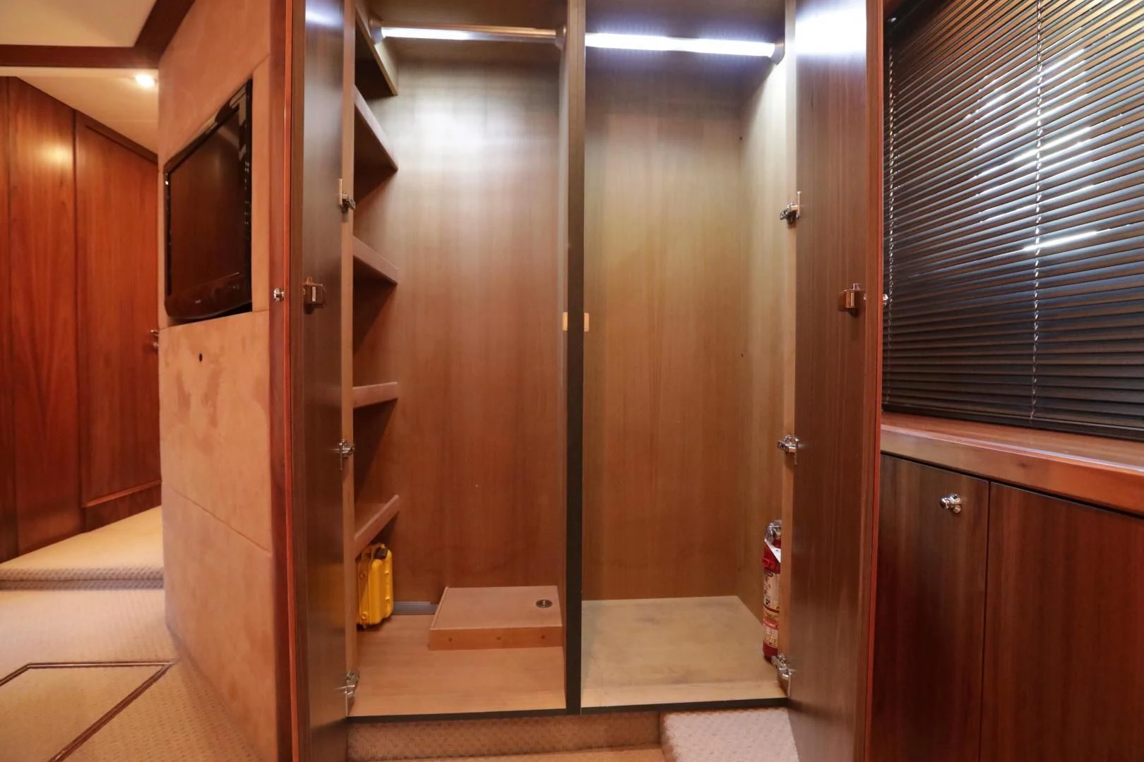 a room with wooden cabinets aboard CAPRICHO II Yacht for Sale