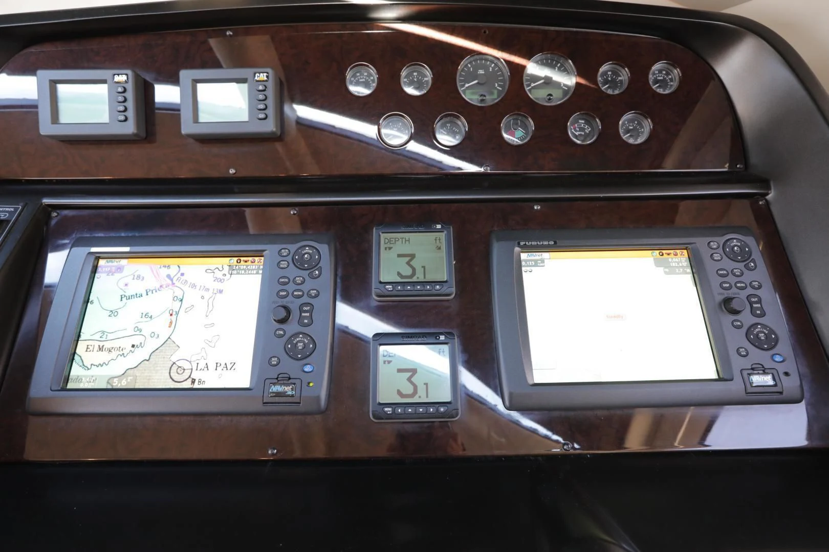 a group of old cell phones aboard CAPRICHO II Yacht for Sale