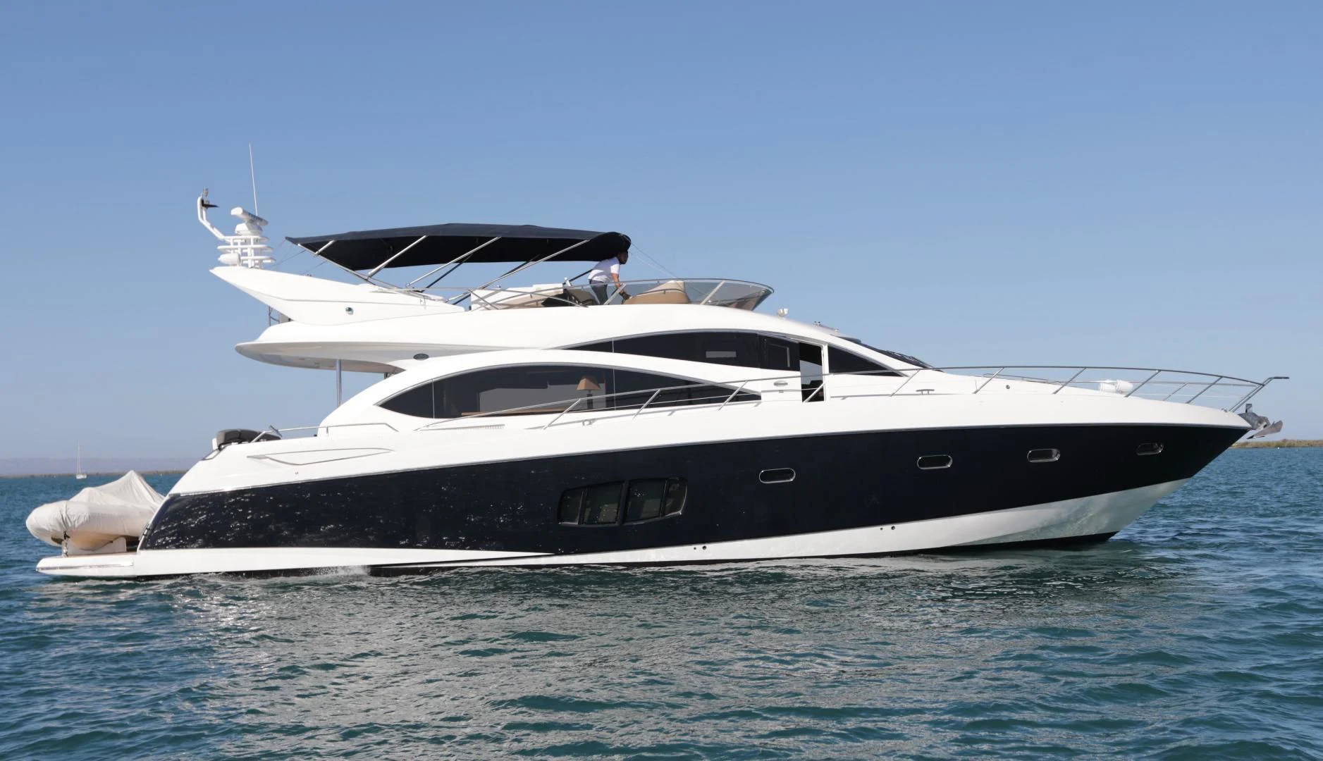 a white yacht in the water aboard CAPRICHO II Yacht for Sale