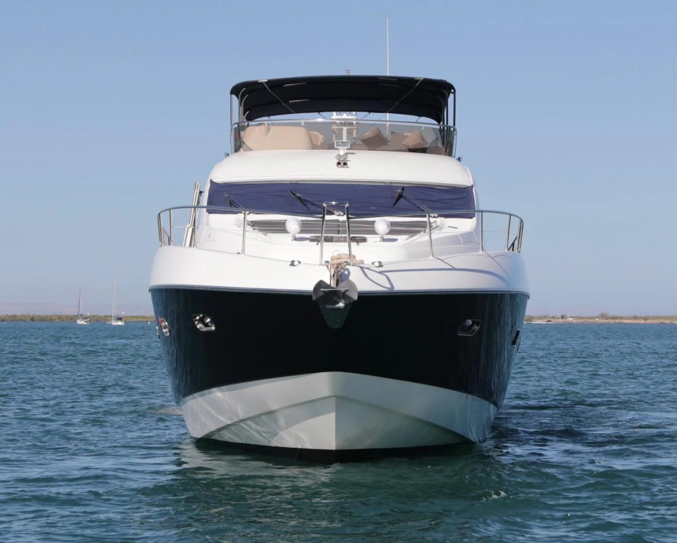 a white boat in the water aboard CAPRICHO II Yacht for Sale