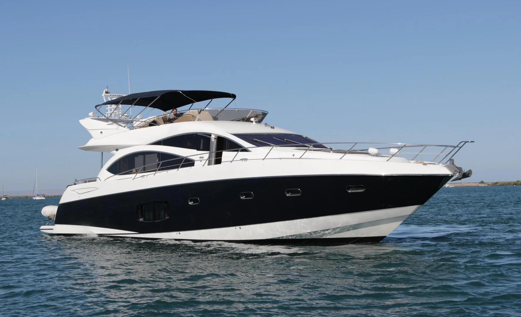 a white yacht on the water aboard CAPRICHO II Yacht for Sale