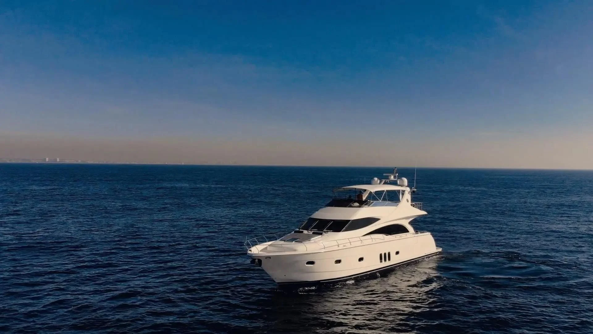 a white yacht in the water aboard STARTING OVER Yacht for Sale