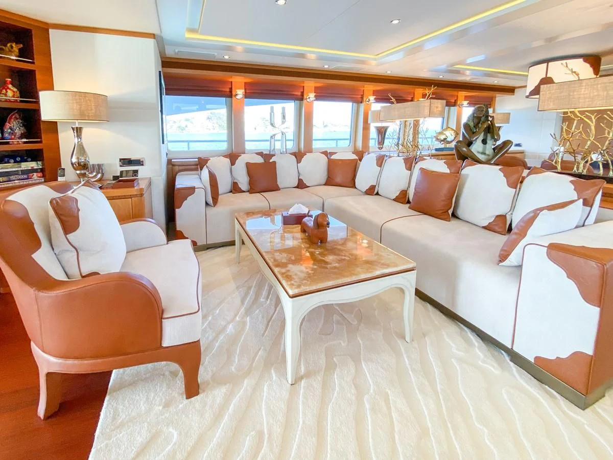 a living room with a large window aboard SHARKFINN Yacht for Sale