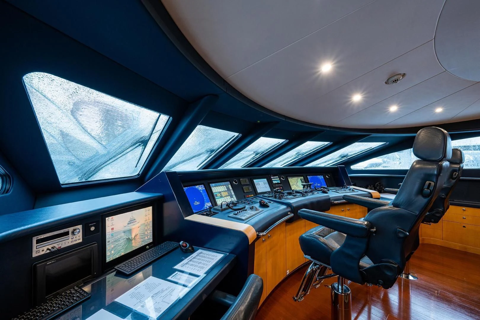 a room with computers and monitors aboard SHARKFINN Yacht for Sale