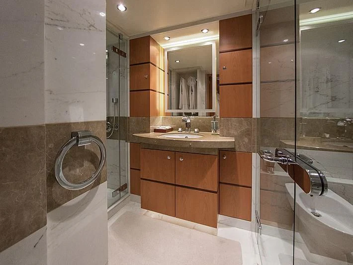 a bathroom with a sink and a bathtub aboard SHARKFINN Yacht for Sale