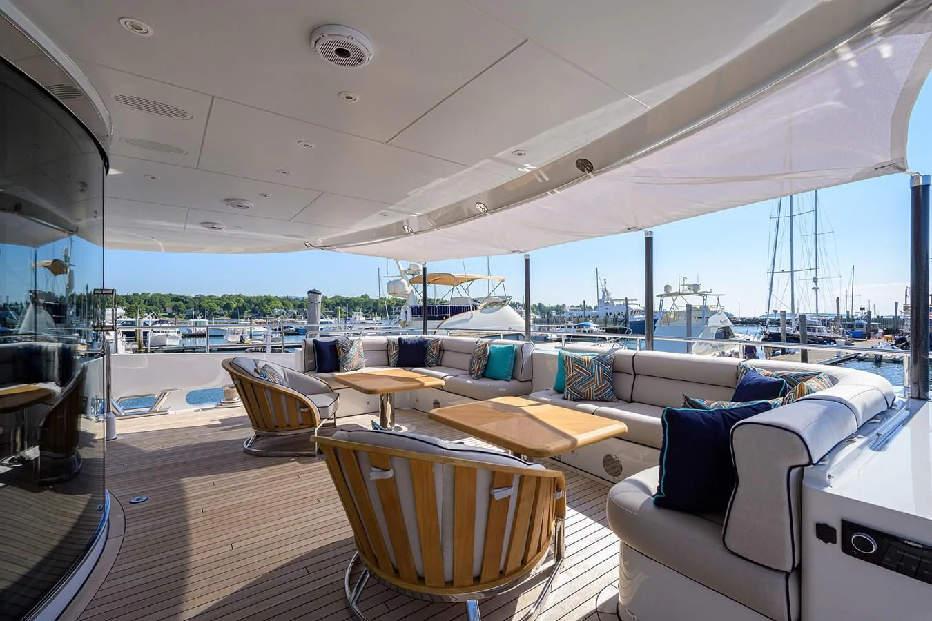 a large room with a view of the water and the deck aboard SHARKFINN Yacht for Sale