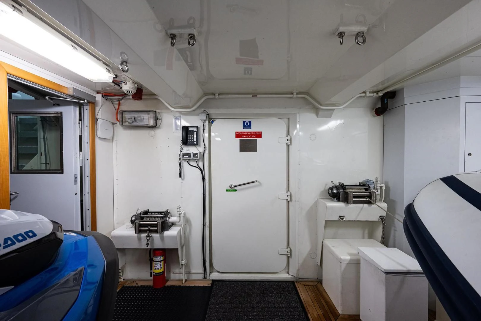 a room with a machine aboard SHARKFINN Yacht for Sale