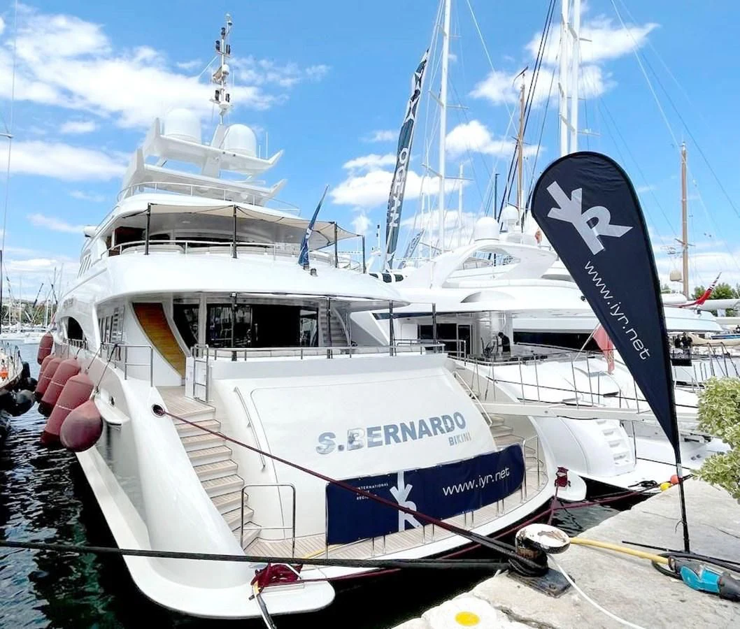 a boat with a flag on the front aboard SHARKFINN Yacht for Sale