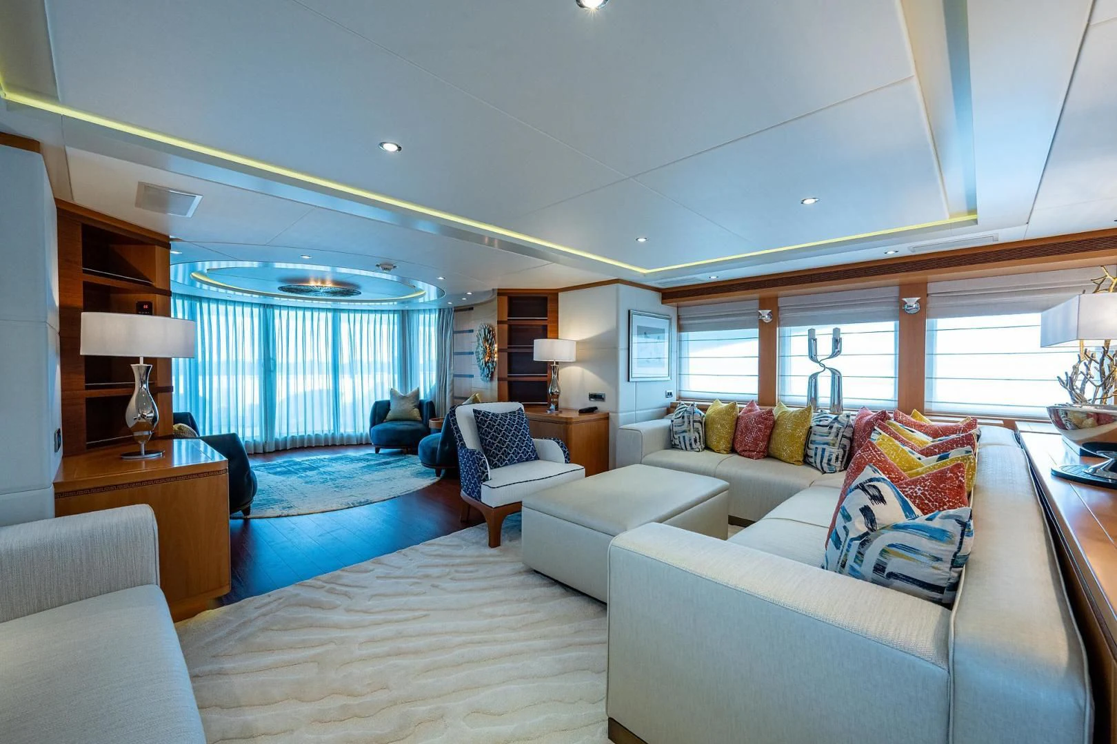 a large living room with a large window aboard SHARKFINN Yacht for Sale