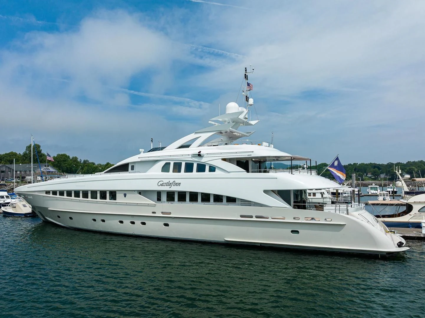 a large white boat in the water aboard SHARKFINN Yacht for Sale
