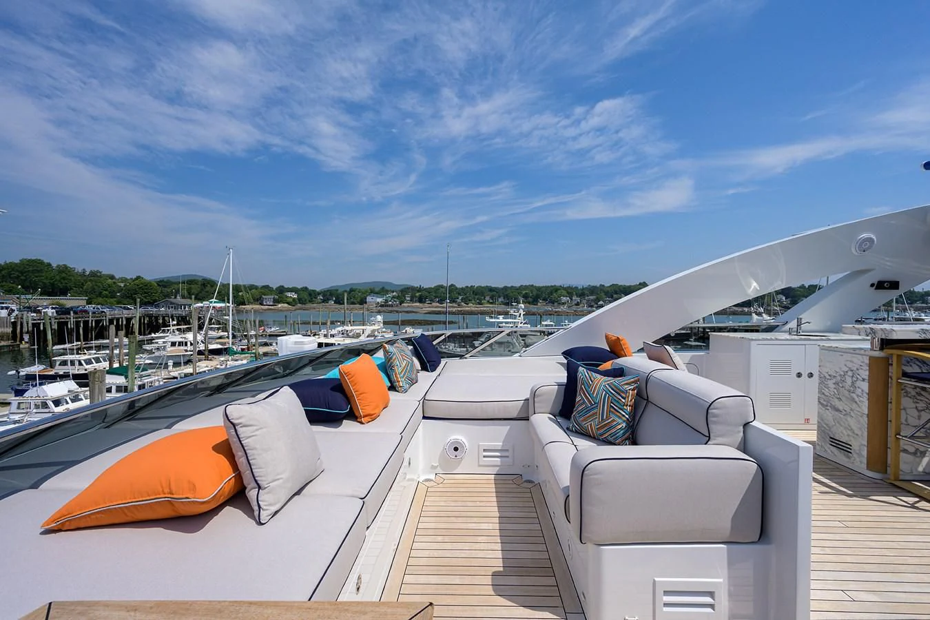 a deck with a view of a marina and boats aboard SHARKFINN Yacht for Sale