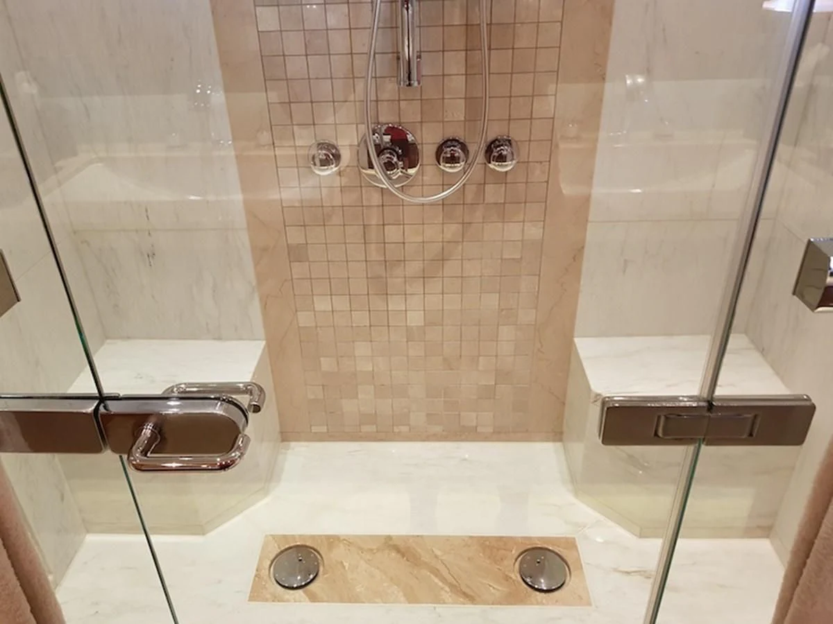 a bathroom with a shower unit aboard SHARKFINN Yacht for Sale