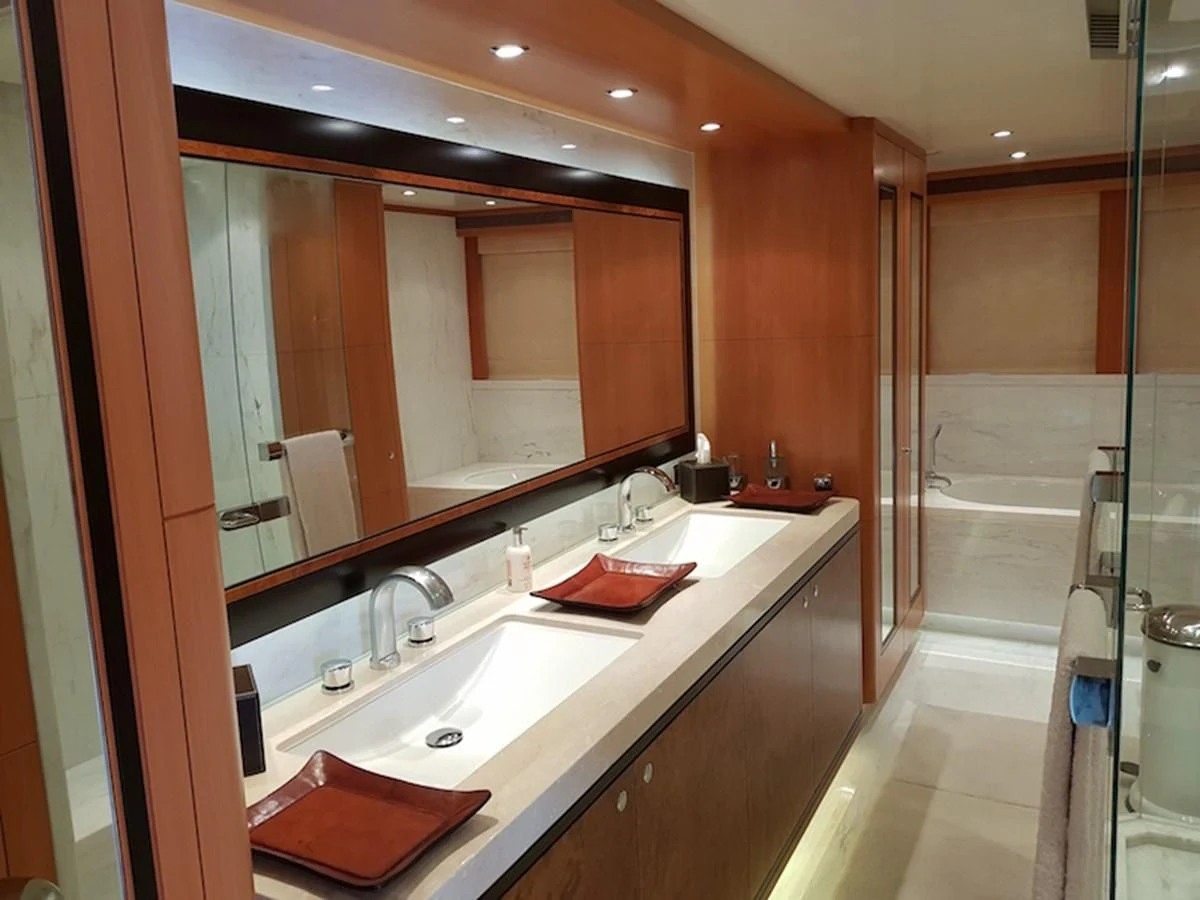 a bathroom with a large mirror aboard SHARKFINN Yacht for Sale