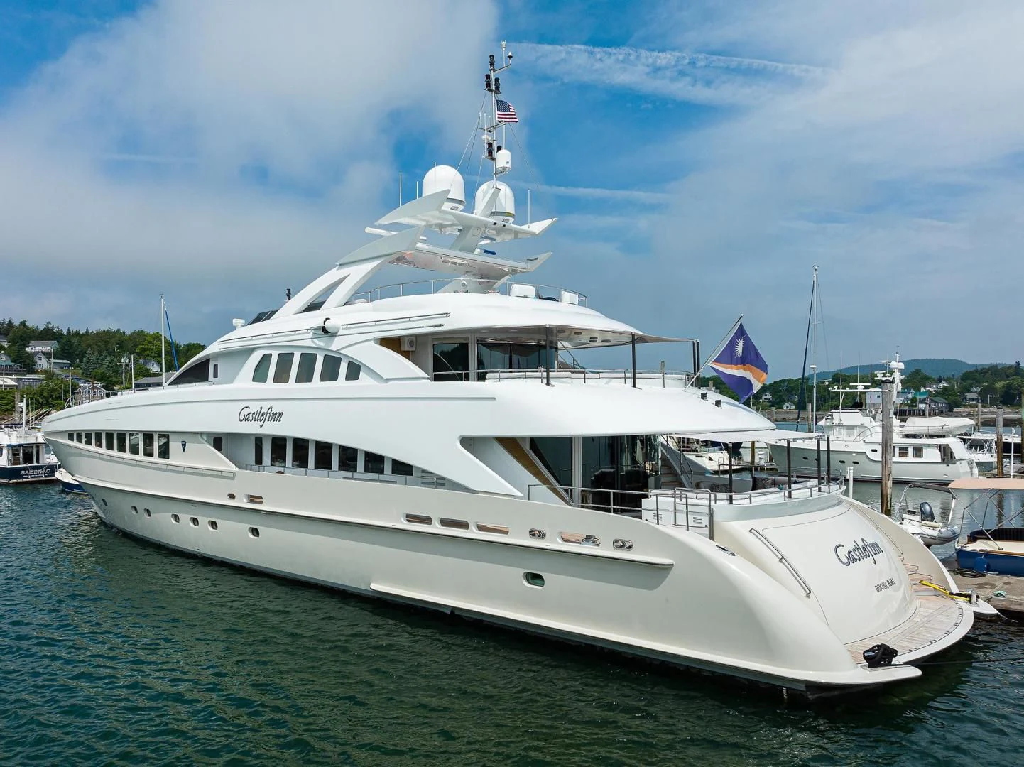a large white boat in the water aboard SHARKFINN Yacht for Sale