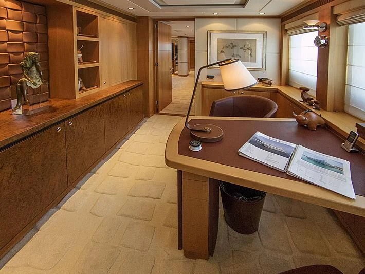 a kitchen with a table and chairs aboard SHARKFINN Yacht for Sale