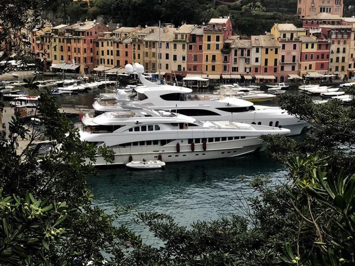a large boat is parked in the water aboard SHARKFINN Yacht for Sale