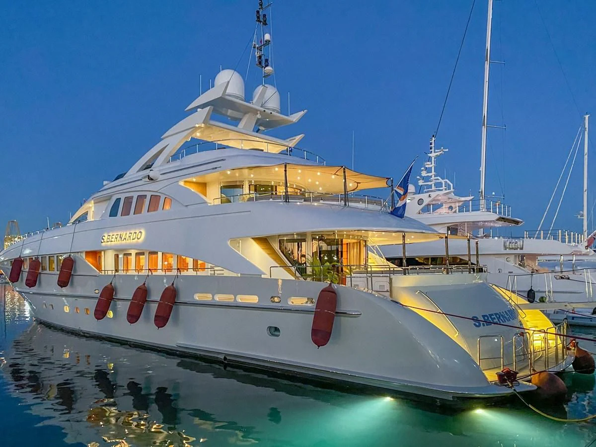a large white and yellow boat aboard SHARKFINN Yacht for Sale