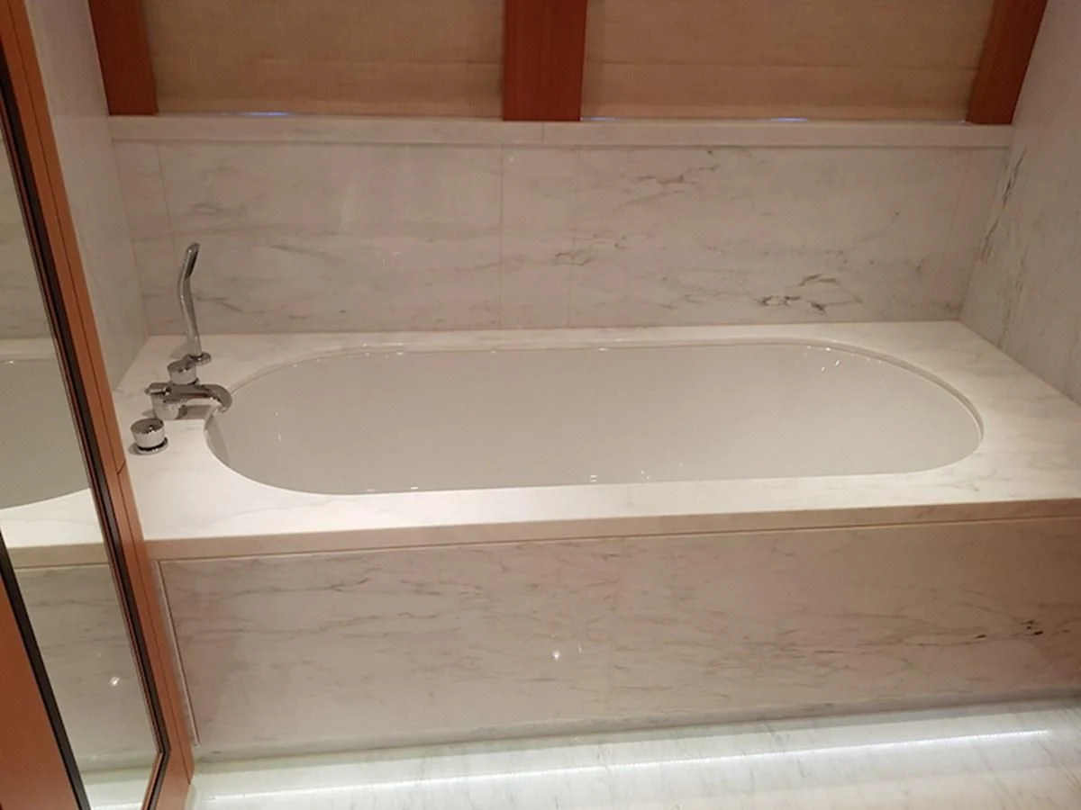 a bathtub in a bathroom aboard SHARKFINN Yacht for Sale