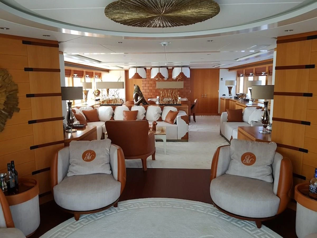 a large living room with a large bed and a large window aboard SHARKFINN Yacht for Sale