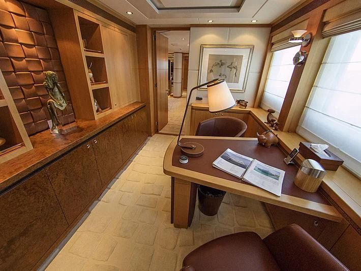 a room with a table and chairs aboard SHARKFINN Yacht for Sale