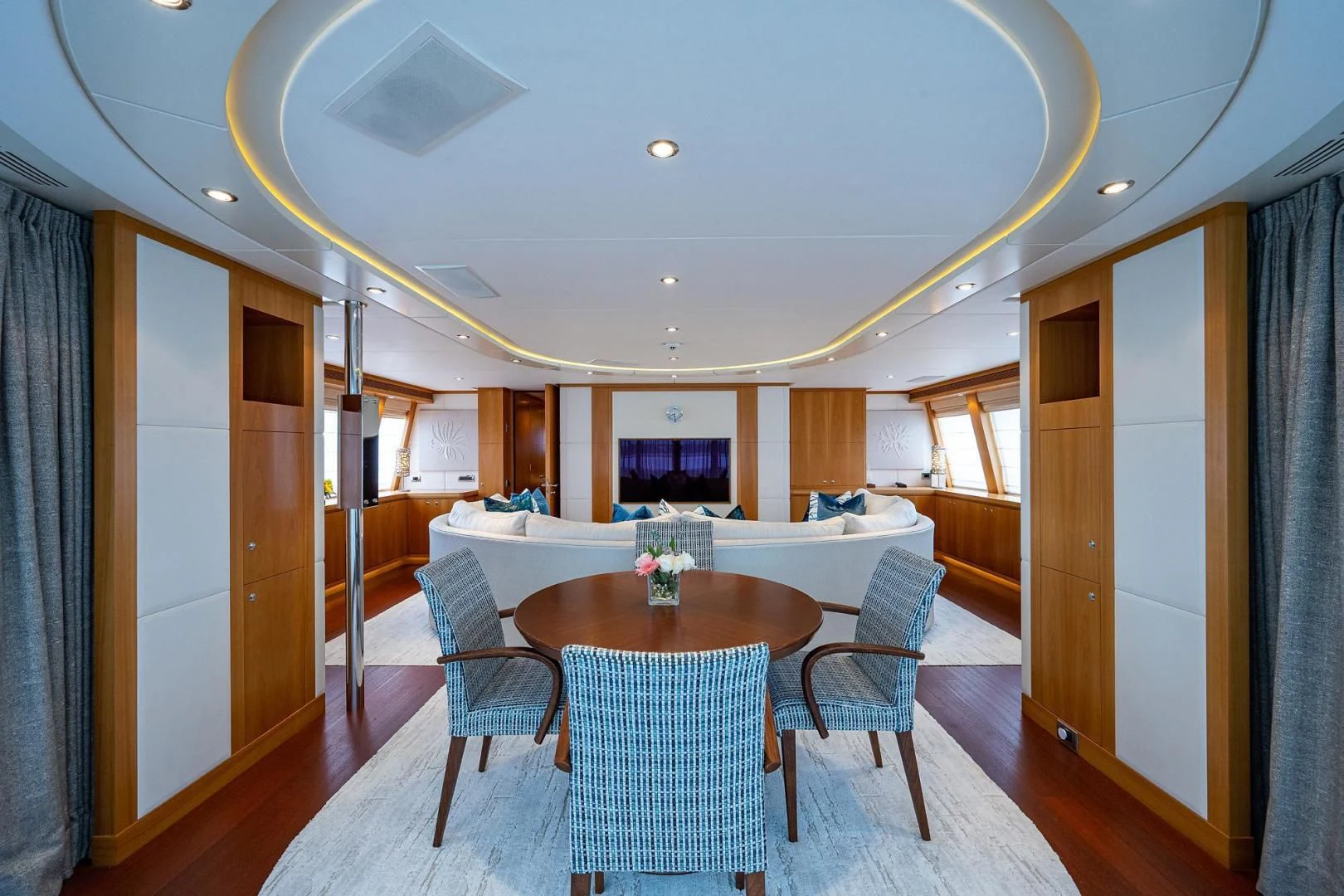 a large room with a table and chairs aboard SHARKFINN Yacht for Sale