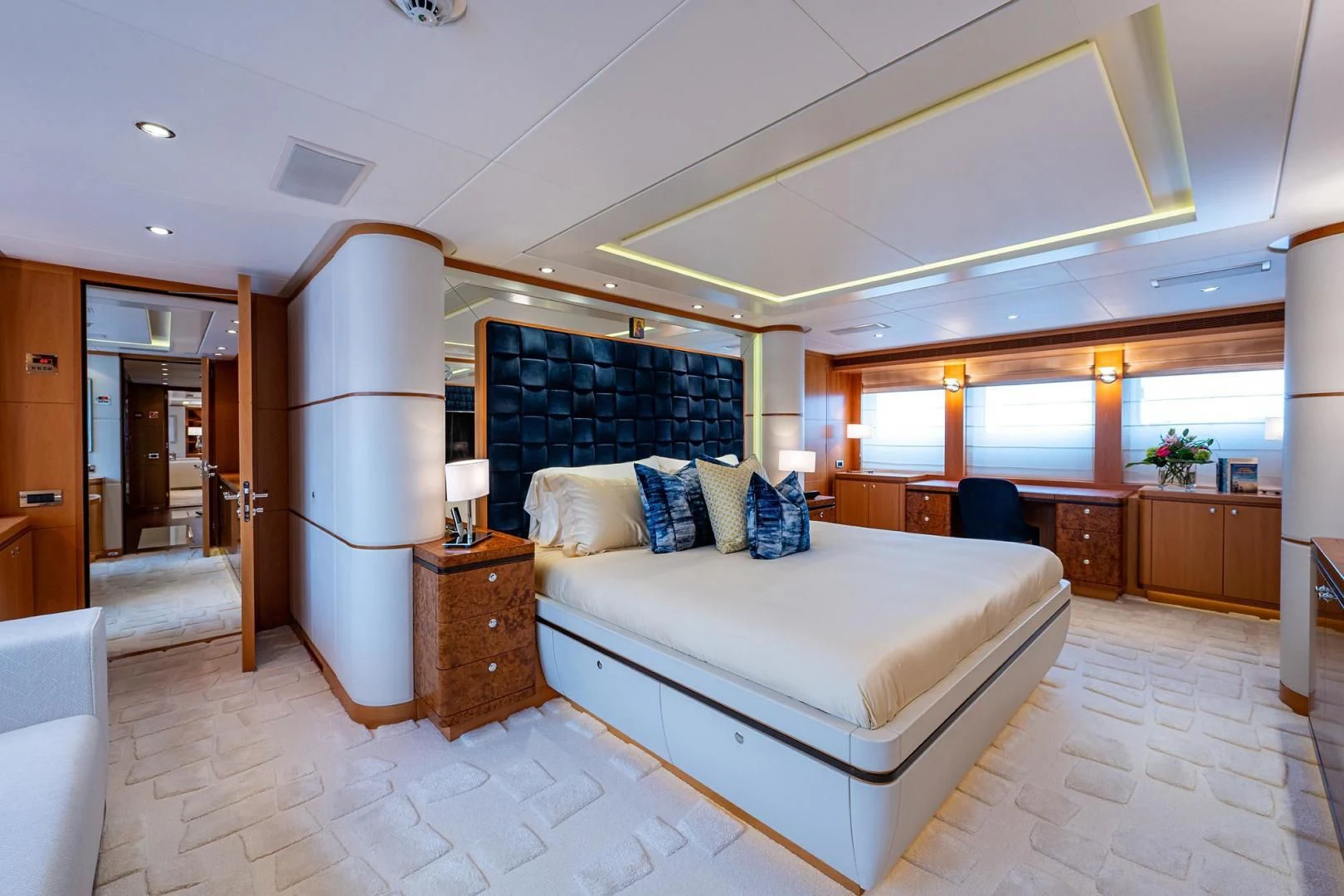 a large bedroom with a large bed aboard SHARKFINN Yacht for Sale