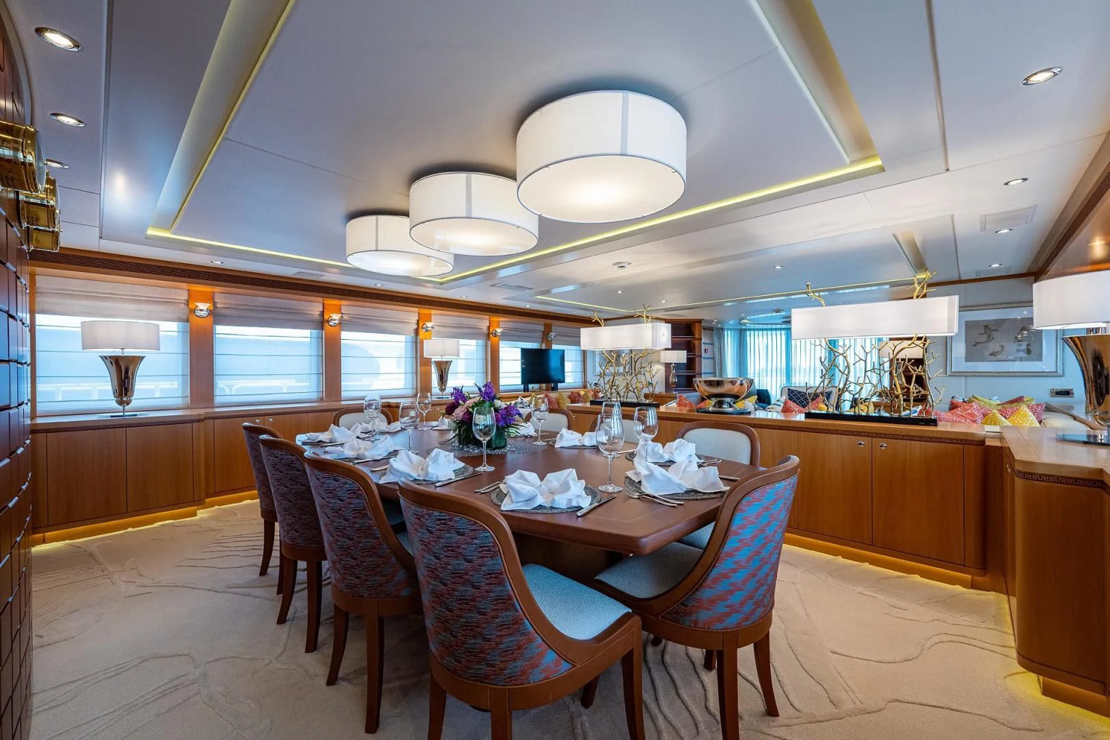 a large kitchen with a dining table aboard SHARKFINN Yacht for Sale