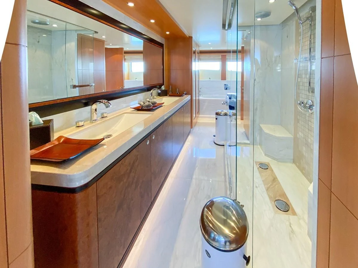 a bathroom with a large mirror aboard SHARKFINN Yacht for Sale