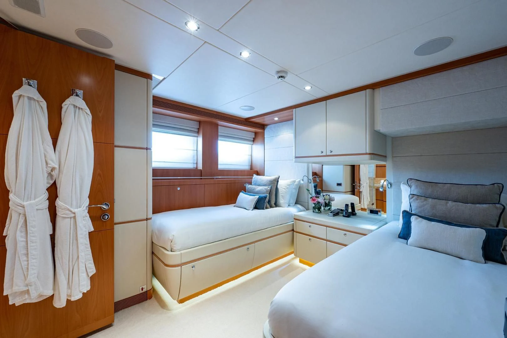 a room with a bed and a closet aboard SHARKFINN Yacht for Sale