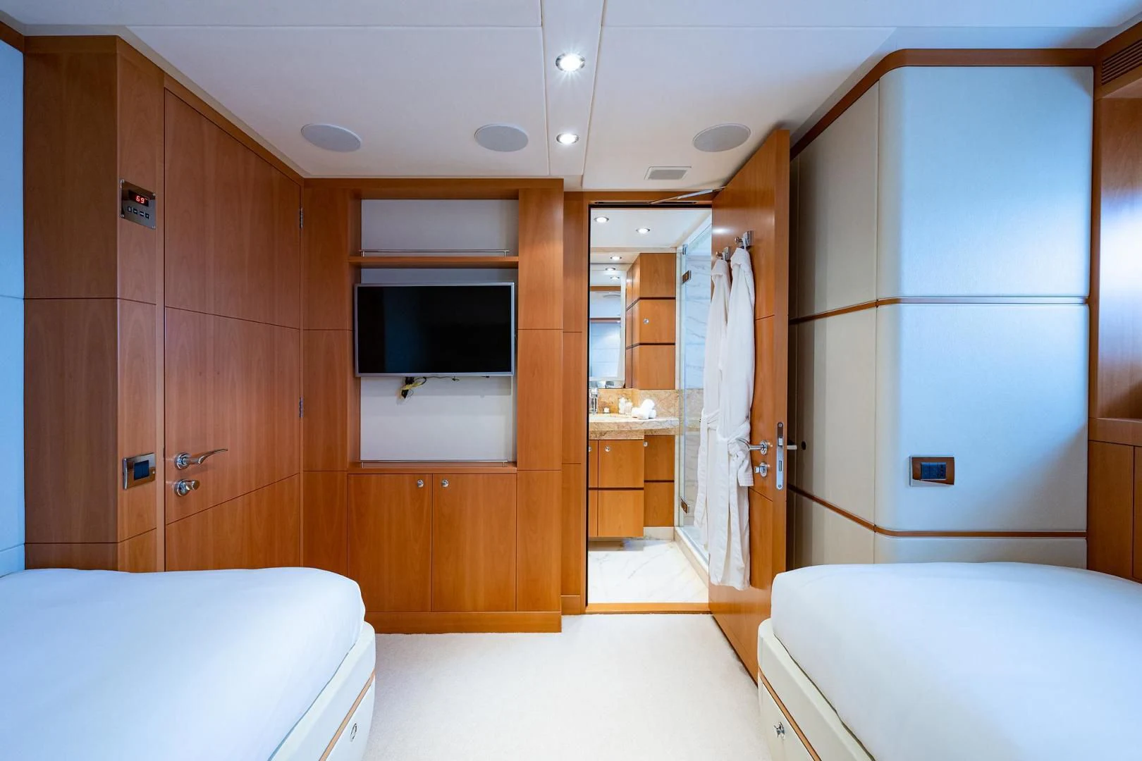a room with a bed and a closet aboard SHARKFINN Yacht for Sale