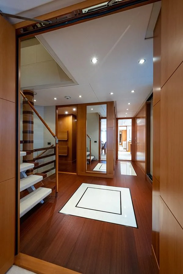 a hallway with a glass door aboard SHARKFINN Yacht for Sale