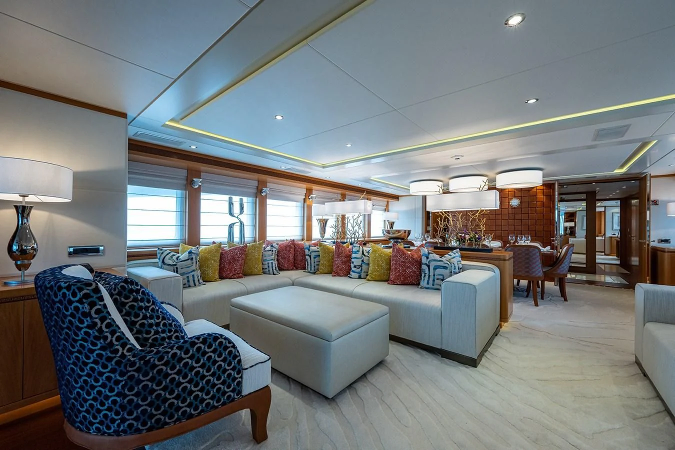 a living room with a couch and a table aboard SHARKFINN Yacht for Sale